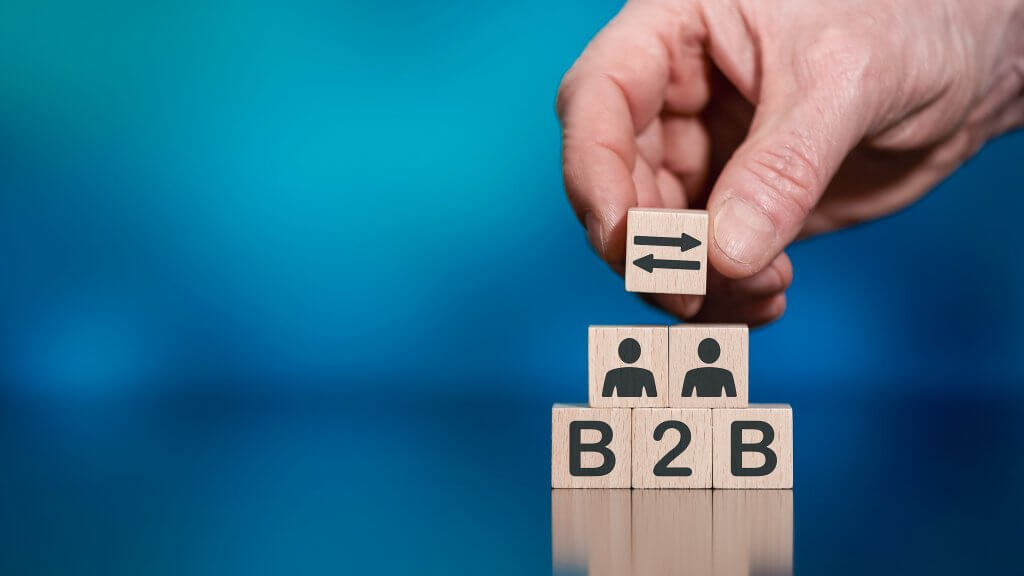 Concept of B2B with icons on wooden cubes